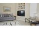 Living room with comfy seating and built-in shelving at 5622 Sir Churchill Dr, Leesburg, FL 34748