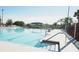 Community pool with steps and handrail access at 5622 Sir Churchill Dr, Leesburg, FL 34748