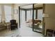 Bright sunroom with comfy seating, accessed through sliding doors at 5622 Sir Churchill Dr, Leesburg, FL 34748