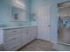 Clean bathroom with double vanity, shower, and a modern design at 5626 Squires Dr, Leesburg, FL 34748