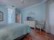 Spacious bedroom with light blue walls and plenty of natural light, offering a relaxing atmosphere at 5626 Squires Dr, Leesburg, FL 34748