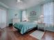 Light and airy bedroom with a light blue color scheme and plenty of natural light at 5626 Squires Dr, Leesburg, FL 34748