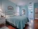 Bright bedroom with ensuite bathroom access and a tranquil atmosphere at 5626 Squires Dr, Leesburg, FL 34748