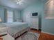 Serene bedroom with light walls and a dresser at 5626 Squires Dr, Leesburg, FL 34748
