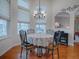 Bright breakfast nook with round table and chairs, offering views of backyard at 5626 Squires Dr, Leesburg, FL 34748