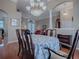 Bright dining room with hardwood floors and a large table, offering views to other rooms at 5626 Squires Dr, Leesburg, FL 34748