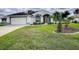 Single story home with attached garage and manicured lawn at 5626 Squires Dr, Leesburg, FL 34748