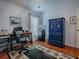 Bright home office features built-in shelving and wood flooring at 5626 Squires Dr, Leesburg, FL 34748