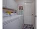 Convenient laundry room with washer, dryer, and ample storage at 5626 Squires Dr, Leesburg, FL 34748