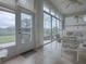 Spacious sunroom with backyard views and tiled flooring at 5626 Squires Dr, Leesburg, FL 34748