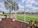 Sunroom with backyard views and fountain feature at 5626 Squires Dr, Leesburg, FL 34748