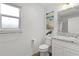 Simple bathroom with toilet and single vanity at 6182 Dingman Way, The Villages, FL 32163