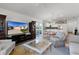 Open living room with a view of the kitchen and dining area at 6182 Dingman Way, The Villages, FL 32163