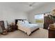 Spacious main bedroom with a queen bed and ample natural light at 6182 Dingman Way, The Villages, FL 32163