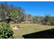 Landscaped backyard with lush lawn at 8065 Penrose Pl, Wildwood, FL 34785