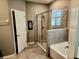 Modern bathroom with large shower and soaking tub, great for relaxation at 8065 Penrose Pl, Wildwood, FL 34785