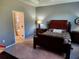 Charming bedroom with ensuite bathroom access and a comfortable bed at 8065 Penrose Pl, Wildwood, FL 34785