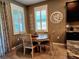 Bright breakfast nook features a round table with four chairs, perfect for morning meals at 8065 Penrose Pl, Wildwood, FL 34785