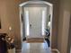 Bright and spacious entryway with a console table and decorative accents at 8065 Penrose Pl, Wildwood, FL 34785