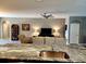 Open kitchen with a large island and breakfast bar, overlooking the living room at 8065 Penrose Pl, Wildwood, FL 34785