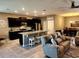 Modern kitchen with granite countertops, stainless steel appliances, and an island at 8065 Penrose Pl, Wildwood, FL 34785
