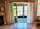 View of backyard patio from sliding glass doors at 8065 Penrose Pl, Wildwood, FL 34785