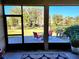 Relaxing screened patio with seating and yard view at 8065 Penrose Pl, Wildwood, FL 34785