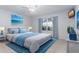 Main bedroom with a plush bed, window, and calming decor at 9001 Village Green Blvd, Clermont, FL 34711