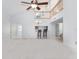 Open living area with high ceilings, loft, and breakfast bar at 9001 Village Green Blvd, Clermont, FL 34711