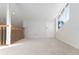 Bright loft area with a door and large window at 9001 Village Green Blvd, Clermont, FL 34711
