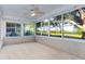 Sunroom with large windows and view of backyard at 9001 Village Green Blvd, Clermont, FL 34711