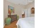 Bedroom with wood floors and built-in dresser at 906 Drakeswood Ave, The Villages, FL 32162