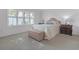 Well-lit bedroom with a comfortable bed and plenty of space at 906 Drakeswood Ave, The Villages, FL 32162
