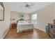 Bedroom with wood floors and ceiling fan at 906 Drakeswood Ave, The Villages, FL 32162