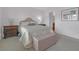Bright bedroom with a queen-size bed and ample natural light at 906 Drakeswood Ave, The Villages, FL 32162