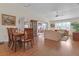 Combined living and dining area with hardwood floors and wood furniture at 906 Drakeswood Ave, The Villages, FL 32162