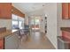 Kitchen with view of screened patio from breakfast nook at 906 Drakeswood Ave, The Villages, FL 32162