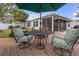 Brick patio with a table and chairs, perfect for outdoor dining at 906 Drakeswood Ave, The Villages, FL 32162