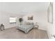 Bright bedroom with carpeted floor, ceiling fan, and window at 913 Allagash Ave, The Villages, FL 32162