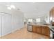 Modern kitchen with stainless steel appliances and light wood cabinets at 913 Allagash Ave, The Villages, FL 32162