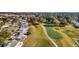 Aerial view showing homes and golf course at 934 Orchid St, The Villages, FL 32159