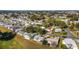 Aerial view of neighborhood near golf course at 934 Orchid St, The Villages, FL 32159