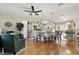 Open concept dining area with hardwood floors and kitchen island view at 934 Orchid St, The Villages, FL 32159