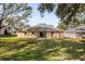 Spacious backyard with grassy lawn and patio at 979 Princeton Dr, Clermont, FL 34711