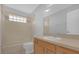 Bathroom with beige tile, a bathtub, and wood vanity at 979 Princeton Dr, Clermont, FL 34711