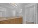 Bathroom with double vanity and light wood cabinets at 979 Princeton Dr, Clermont, FL 34711