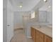 Main bathroom with soaking tub and double vanity at 979 Princeton Dr, Clermont, FL 34711