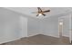 Bedroom with ceiling fan, wood flooring, and access to bathroom at 979 Princeton Dr, Clermont, FL 34711
