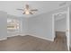 Spacious bedroom with ceiling fan and wood-look flooring at 979 Princeton Dr, Clermont, FL 34711