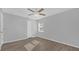 Well-lit bedroom featuring a ceiling fan and wood-look floors at 979 Princeton Dr, Clermont, FL 34711